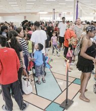 Well-heeled, ready for school- Hundreds of youngsters and their families benefited from New Shoes for Back To School, a ministry started by Third Street Bethel AME Church. The project is now shared by 13 area churches to get youngsters ready for the school year with a new pair of shoes. Lines already had formed when the doors opened 8 a.m. on Labor Day.