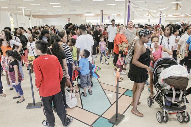 Well-heeled, ready for school- Hundreds of youngsters and their families benefited from New Shoes for Back To School, a ministry started by Third Street Bethel AME Church. The project is now shared by 13 area churches to get youngsters ready for the school year with a new pair of shoes. Lines already had formed when the doors opened 8 a.m. on Labor Day.