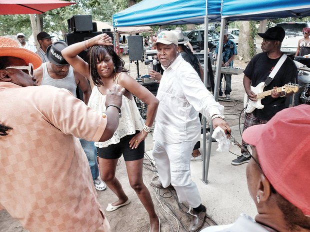 West End neighborhood reunion-Music, dancing, food and fun reigned Monday at the annual West End Reunion in Byrd Park. Brenda Davies and Phillip Brown dance to the sounds of Tin Man and the Band 