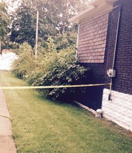 An area in Riverdale, Ill. was blocked by police tape. Four bodies were found in the garage of a residence. 