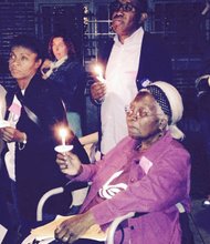 Protesters hold a prayer vigil last week outside President Barack Obama's home in the Kenwood neighborhood in Chicago. The group wants a high school specializing in science. 