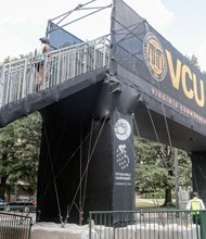 This bridge allows pedes- trians to cross West Main Street during the upcoming bike races.
Location: Between Cherry and Harrison streets on the Virginia Commonwealth University campus. This is one of two temporary bridges VCU has set up along the route of the world cycling competition. The other is at West Franklin and Shafer streets.