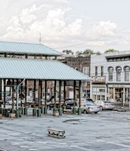 This is the new look of Richmond’s Farmers’ Market on 17th Street in Shockoe Bottom. Most of the green-topped sheds, fixtures since 1986, are gone, creating a more open space for public events. The remaining sheds allow the 236-year-old market to remain in operation. The shed removal, which cost about $88,000, is the first step in a planned $2.5 million facelift for the market, including the installation of promenades and new landscaping. This photo was taken a few days before the start of the UCI Road World Championships.