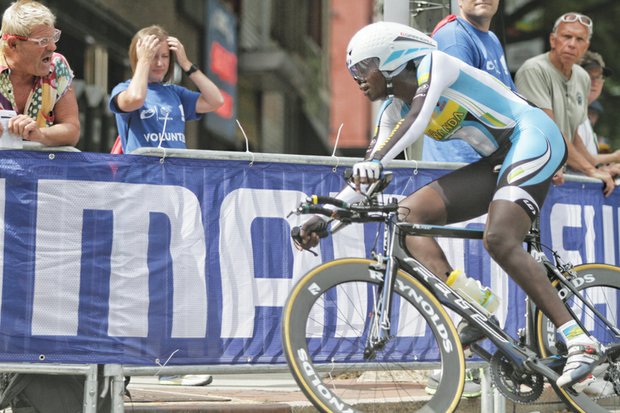Jeanne D’arc Girubuntu of Team Rwanda races up Broad Street
on Tuesday during the Women’s Elite Individual Time Trial, making history as the first black woman to compete in the UCI Road World Championships. She is the lone female on the Rwandan team.