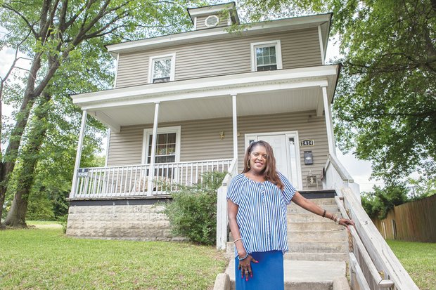 Gwendolyn H. MacClenahan stands in front of the Highland Park house she planned to turn into a group home where women released from prison could begin to rebuild their lives. Location: 2414 4th Ave.