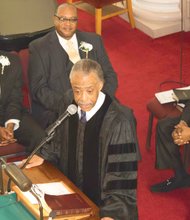 The Rev. Al Sharpton delivers the morning message at Gillfield Baptist Church in Petersburg on Sunday during its Men’s Day service, with Yonathan A. Seward, left, and Bob McNeil seated nearby.