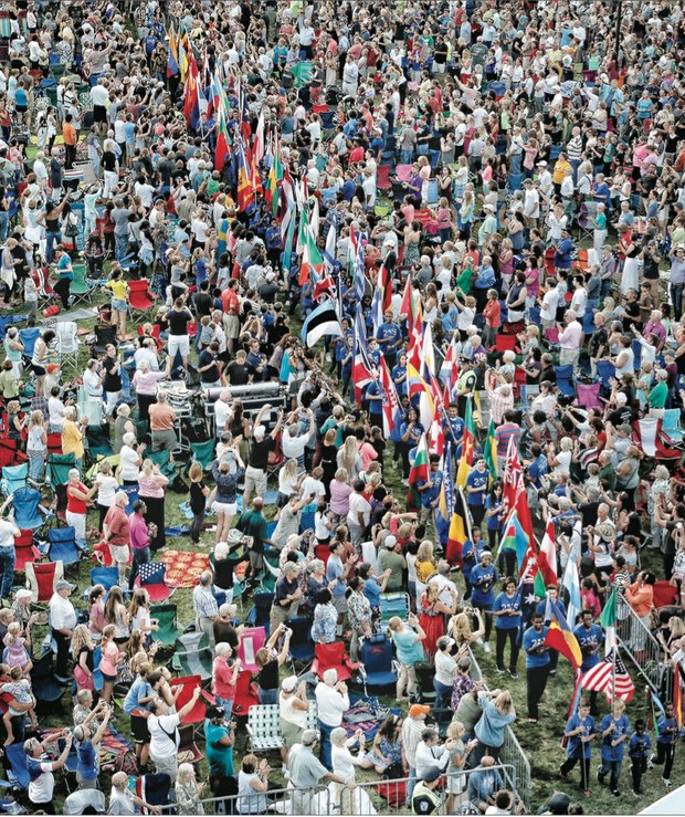 
Thousands of spectators packed Brown’s Island for the opening ceremonies of the UCI bike races, where students from Richmond Public Schools and surrounding counties carried flags representing the 74 participating countries.