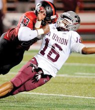 Virginia Union University quarterback Andre Coble is taken to the turf by Gardner-Webb University’s Jebrai Regan during a pass attempt. The visiting Panthers lost 13-9 last Saturday. 
