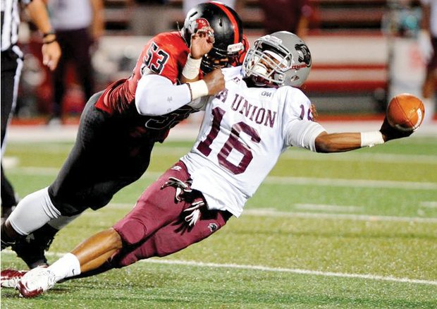 Virginia Union University quarterback Andre Coble is taken to the turf by Gardner-Webb University’s Jebrai Regan during a pass attempt. The visiting Panthers lost 13-9 last Saturday. 
