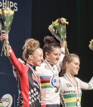 Sharing victory smiles, Team USA’s Cloe Dygert, center, and Emma White, left, won gold and silver medals, respectively, Monday in
the Women’s Junior Individual Time Trial. Anna-Leeza Hull, right, of Australia won the bronze.