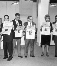 Dr. Allix B. James, left, checks out a prototype of the new Richmond Free Press with other members of the board of directors of Paradigm Communications Inc., which publishes the newspaper. Location: The newspaper’s first newsroom at Broad and Adams streets in Downtown. Other board members, from left, Dr. Elwood Boone Jr., Free Press founder the late Raymond H. Boone, the late Dr. Darrel Rollins, the late Dr. William Thornton, Beverly Davis, Leonard Lambert, Dr. Lerla Joseph and Clarence L. Townes Jr.