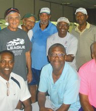 Members of the Tennisbums, left to right, seated: James “Plunky” Branch, Roland Cuffee, Mack Hardison. Standing, left to right: James Carr, Glenn Van Tuyle, Charles Brown, Sa’ad El-Amin, Coach Larry Kelly, Robert Boddie and Don Miller. Members Guy Chance and James Junius are not present.