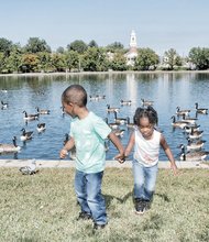 Bye, bye birdies -
Aidan Landers, 3, looks over his shoulder at the Canada geese flocking Wednesday in Fountain Lake as he leads his 2-year-old sister, Aaliyah, on a walk in Byrd Park. The siblings were on a sunny, autumn outing with their mother, Jayvonne Landers.