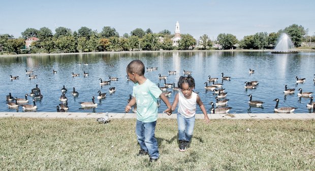Bye, bye birdies -
Aidan Landers, 3, looks over his shoulder at the Canada geese flocking Wednesday in Fountain Lake as he leads his 2-year-old sister, Aaliyah, on a walk in Byrd Park. The siblings were on a sunny, autumn outing with their mother, Jayvonne Landers.