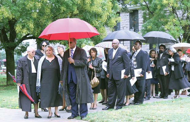 Dr. James’ daughter, Portia James-Stubbs, leads family and close friends into the service, including Dr. James’ goddaughter, former Richmond Circuit Court Judge Margaret P. Spencer and husband U.S. District Court Judge James R. Spencer, center. 