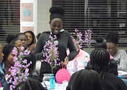 A participant plays a game during “Girl Code.” Empowering games ignited discussions between peers, leaders and volunteers. 198 teen and “tween” girls registered for the symposium.