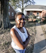 Charlene C. Harris stands in front of her two-bedroom home in the West End. She has been told to buy it or face having to move. Location: 1600 Colorado Ave. 