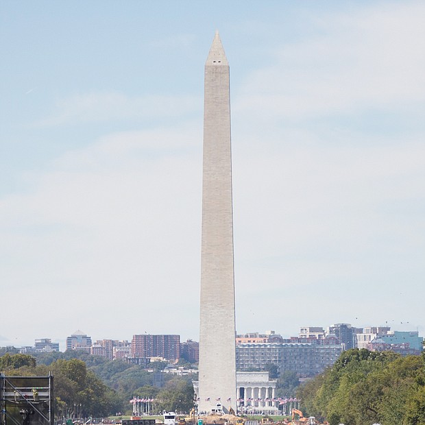 Million Man March 20 years later -
Throngs of people from across the nation flooded the National Mall in Washington for the Justice Or Else rally marking the 20th anniversary of the Million Man March. People of all ages, ethnicities, faiths and backgrounds were drawn to the capital for the event initiated by Nation of Islam leader Minister Louis Farrakhan. A number of speakers and activists addressed participants, calling for changes in the conditions that oppress African-Americans and other marginalized people. Coverage, B3.
By Jeremy M. Lazarus
Charlene C. Harris hoped to live out her years at 1600 Colorado Ave., the single- family brick cottage that she and her family have called home for 47 years.
But now the retired 68-year- old state employee is being told she must either purchase the two-bedroom home from her landlord, the Richmond Redevelopment and Housing Authority, or face moving.
“It’s a terrible situation,” she said. “RRHA has told me I have to put up $500 to begin the process and to get a mortgage by December. Otherwise, I would have to accept relocation.”
Like other public housing tenants of such homes, she feels caught in a Catch-22. Until she puts up the $500, RRHA won’t provide an appraisal that would let her know what the sales price would be so she could figure out if she could afford
Sandra Sellars/Richmond Free Press
Charlene C. Harris stands in front of her two-bedroom home in the West End. She has been told to buy it or face having to move. Location: 1600 Colorado Ave.
RRHA residents in ‘buy or move’ spot
the house on her fixed income of about $1,500 a month.
It is an ironic twist that RRHA is now marking its 75th