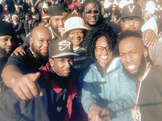 Richmond Delegate Delores L. McQuinn, white hat, and her son, James “J.J.” Minor, sunglasses, pause for a photo with family and friends in the massive crowd at the rally on the National Mall in Washington. 