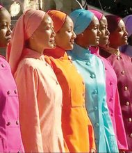 Muslim women in the Nation of Islam’s female training program take the stage during the Justice Or Else rally.