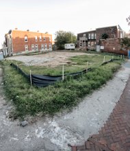 Construction fencing surrounds the site at 2nd and Leigh streets where the 31-unit Eggleston Plaza is to rise. The land has been vacant since 2009, when the historic Eggleston Hotel was razed after it collapsed.