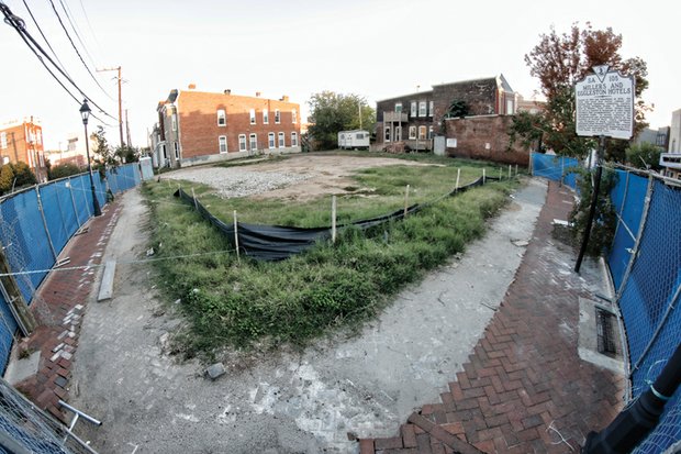 Construction fencing surrounds the site at 2nd and Leigh streets where the 31-unit Eggleston Plaza is to rise. The land has been vacant since 2009, when the historic Eggleston Hotel was razed after it collapsed. 