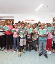 One School, One Book //

Principal Mary Townes, right rear, Vice Principal Linda York, left, and students from third- and fourth-grade classes at Oak Grove-Bellemeade Elementary School in Richmond read aloud from a chapter of “Trouble According to Humphrey,” the first of three books youngsters in the One School, One Book challenge are reading during the school year. At an assembly Oct. 15, each student was presented with a book, which is theirs to keep and take home with the hope that youngsters and their parents will read together a chapter each night. Trivia sessions on the book will be held in classes. The initiative, through the Richmond-based nonprofit Read to Them, is designed to boost students’ reading ability while creating a love of reading.