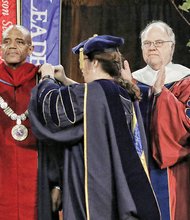 Historic inauguration at UR -
Dr. Ronald A. Crutcher, center, receives the sterling silver Presidential Chain of Office at the University of Richmond from President Emeritus Edward L. Ayers and Dr. Kristine A. Nolin, university marshal and associate professor of chemistry.