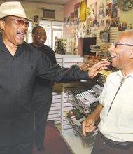 Gospel music icon Dr. Bobby Jones, whose popular TV show “Bobby Jones Gospel” is in its 35th and final season on BET, shares a laugh with Barksdale “Barky” Haggins during a 2011 visit to Barky’s Spiritual Stores on Broad Street in Downtown.