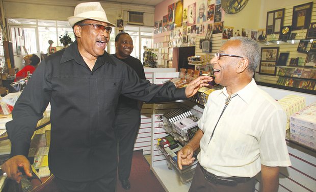 Gospel music icon Dr. Bobby Jones, whose popular TV show “Bobby Jones Gospel” is in its 35th and final season on BET, shares a laugh with Barksdale “Barky” Haggins during a 2011 visit to Barky’s Spiritual Stores on Broad Street in Downtown.