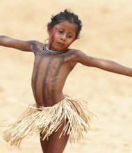 An Indian girl, Kanela plays during the competitions of the World Indigenous Games in Palmas, Brazil, Thursday, Oct. 29, 2015. Organizers billed the nine-day-long event as a sort of indigenous Olympics.