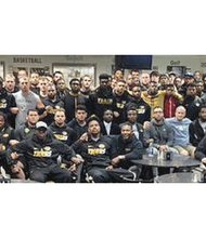 
University of Missouri football Coach Gary Pinkel tweeted this photo of protesters, including students, team members, professors and coaches, with the message, “The Mizzou Family stands as one. We are united. We are behind our players.”