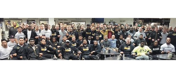 
University of Missouri football Coach Gary Pinkel tweeted this photo of protesters, including students, team members, professors and coaches, with the message, “The Mizzou Family stands as one. We are united. We are behind our players.”