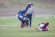 Virginia State University quarterback Tarian Ayres is upended by a Virginia Union University defender during Saturday’s 28-27 win by the Panthers over the host Trojans at Rogers Stadium in Ettrick. 