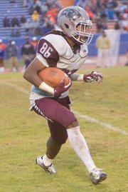 Virginia Union University wide receiver Chazton McKenzie looks for running room during Saturday’s big game against Virginia State University.