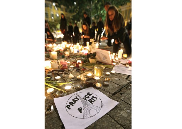 People light candles in tribute to the victims of last Friday’s terrorist attacks in Paris that killed 129 people and injured several hundred others. Across the world, people have displayed their sympathy and solidarity with the French people. This scene was in Nice, in Southern France, on Monday.
