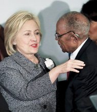 Democratic presidential candidate Hillary Clinton is greeted by attorney Fred D. Gray, who was Rosa Parks’ lawyer 60 years ago after her arrest Dec. 1, 1955, in Montgomery, Ala., for refusing to give up her seat on a public bus to a white person. Mrs. Parks’ actions sparked a yearlong bus boycott and launched the modern Civil Rights Movement. Mrs. Clinton and Mr. Gray spoke Tuesday at a commemoration at Dexter Avenue Baptist Church in Montgomery. 