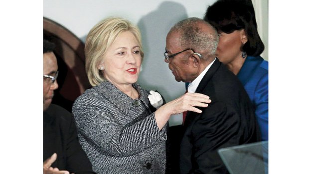 Democratic presidential candidate Hillary Clinton is greeted by attorney Fred D. Gray, who was Rosa Parks’ lawyer 60 years ago after her arrest Dec. 1, 1955, in Montgomery, Ala., for refusing to give up her seat on a public bus to a white person. Mrs. Parks’ actions sparked a yearlong bus boycott and launched the modern Civil Rights Movement. Mrs. Clinton and Mr. Gray spoke Tuesday at a commemoration at Dexter Avenue Baptist Church in Montgomery. 