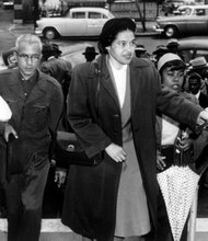 Rosa Parks arrives at the Montgomery, Ala., courthouse with supporters to be arraigned following her arrest Dec. 1, 1955, for refusing to move to the black section in the rear of a city bus. African-Americans then began a boycott of the bus company that lasted for more than a year.