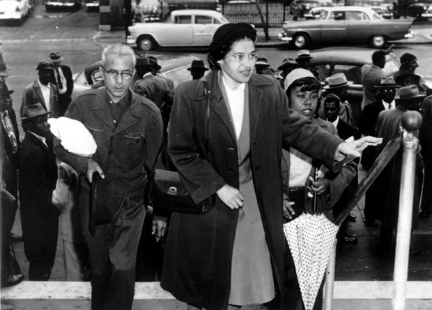 Rosa Parks arrives at the Montgomery, Ala., courthouse with supporters to be arraigned following her arrest Dec. 1, 1955, for refusing to move to the black section in the rear of a city bus. African-Americans then began a boycott of the bus company that lasted for more than a year.