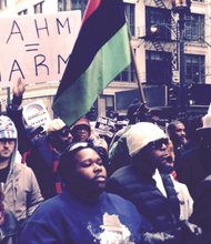 Hundreds march in downtown Chicago to protest the shooting of a black teen killed by a white Chicago police officer.