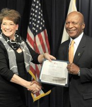 Illinois Secretary of State Jesse White is pictured with Mothers Against Drunk Driving (MADD) National President Colleen Sheehey-Church as he receives the organization’s 2015 Legislative Champion award on November 24, 2015.