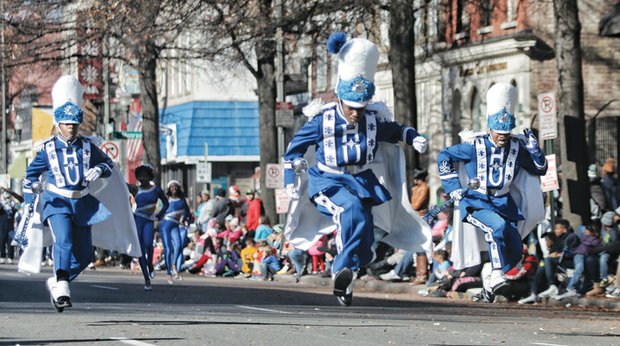 Holiday spirit on parade // Hampton University Drum Majors Terrell White and Curtis Mason move and groove to the sounds of holiday music as they march in the parade.