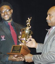 Shawheem Dowdy holds his Lanier Award with Willie Lanier.