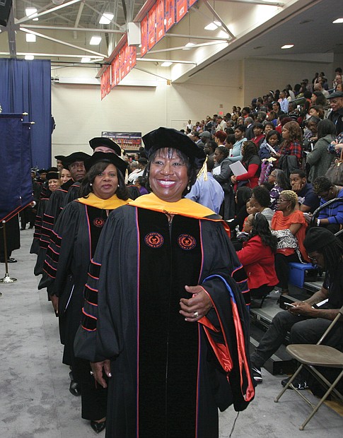 Dr. Pamela V. Hammond, interim president of Virginia State University, leads
the academic procession into the fall commencement ceremony last Saturday at
Daniel Gymnasium on the campus. State Sen. Rosalyn R. Dance of Petersburg, the commencement speaker, is second in the line that includes members of the VSU Board of Visitors, administrators and faculty. Sen. Dance and Dr. Hammond received honorary degrees during the ceremony. 