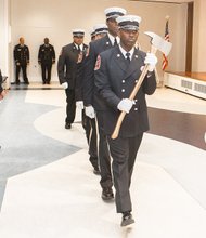 New firefighters // Members of the Richmond Department of Fire and Emergency Services present the colors at the Basic Recruit Graduation Ceremony last Friday at the Richmond Public Main Library in Downtown. 