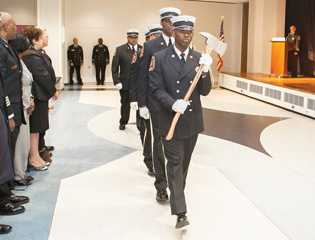 New firefighters // Members of the Richmond Department of Fire and Emergency Services present the colors at the Basic Recruit Graduation Ceremony last Friday at the Richmond Public Main Library in Downtown. 