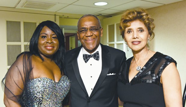 Continentals holiday gala // Lots of warm hugs, laughs and toasts to good times were shared at the Richmond Chapter of The Continental Societies’ Elegance in Black & White fundraising gala last Friday at a Downtown hotel. The event benefits special needs children in Greater Richmond. Left, Nkechi George-Winkler, chapter president and former Mid-Atlantic regional director, enjoys a moment with John C. Purnell Jr., advisory board chair.