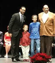 Welcome aboard //
The Rev. Roscoe D. Cooper III, left, proudly stands with sons Landon Riley, 5, and Christian Alexander, 11, and his father, the Rev. Roscoe D. Cooper Jr., after being sworn in Dec. 16 as the Fairfield District representative on the Henrico County School Board. The ceremony, held at the Cultural Arts Center at Glen Allen, included the investiture of two incumbent African-American members of the Henrico Board of Supervisors — Frank J. Thornton of the Fairfield District, seated second from left, and the Rev. Tyrone E. Nelson of the Varina District, fifth from the left. The county’s constitutional officers also were sworn in.