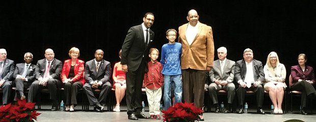 Welcome aboard //
The Rev. Roscoe D. Cooper III, left, proudly stands with sons Landon Riley, 5, and Christian Alexander, 11, and his father, the Rev. Roscoe D. Cooper Jr., after being sworn in Dec. 16 as the Fairfield District representative on the Henrico County School Board. The ceremony, held at the Cultural Arts Center at Glen Allen, included the investiture of two incumbent African-American members of the Henrico Board of Supervisors — Frank J. Thornton of the Fairfield District, seated second from left, and the Rev. Tyrone E. Nelson of the Varina District, fifth from the left. The county’s constitutional officers also were sworn in.